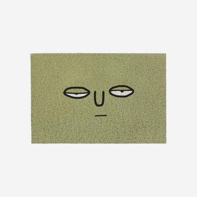 Felpudo verde divertido con cara