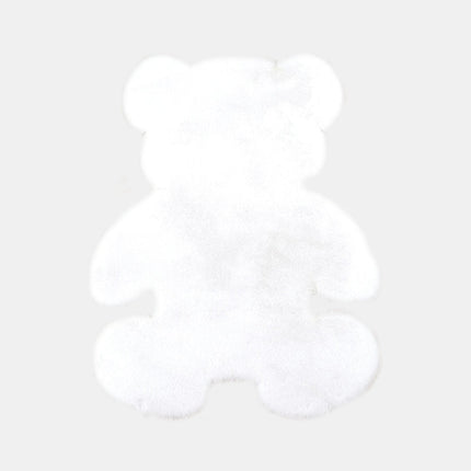 Alfombra infantil blanca con forma de osito.
