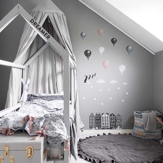 Alfombra redonda gris para cuarto infantil