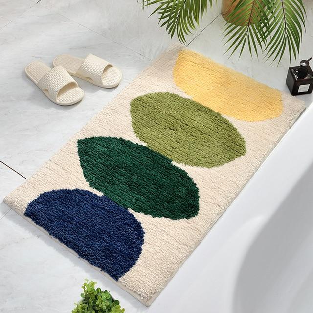 Alfombrilla de baño absorbente verde y blanca
