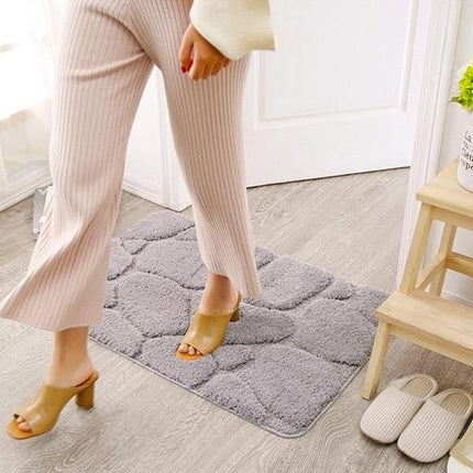 Alfombra de baño con relieve guijarros