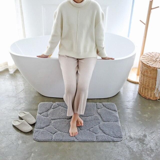 Alfombra de baño con relieve guijarros