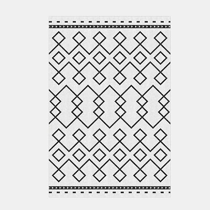 Alfombra nórdica geométrica en blanco y negro.