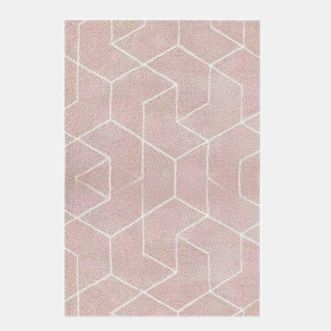 Alfombra geométrica shaggy de color rosa empolvado.